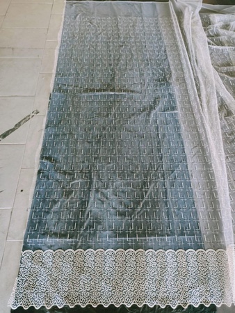 Тюлевая ткань с вышивкой