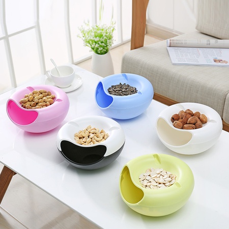 Telefon ve tohumlar, kuruyemişler, çeşitli atıştırmalıklar için kase standı