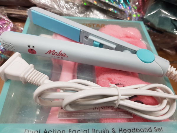 Facial rollers, travel hairdryer and hair straightener.