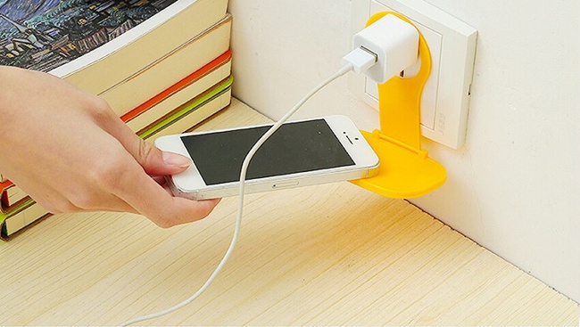 Phone holder for wall socket