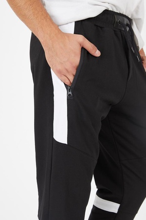 Fermuar cepli parça ve şerit detaylı eşofman altı