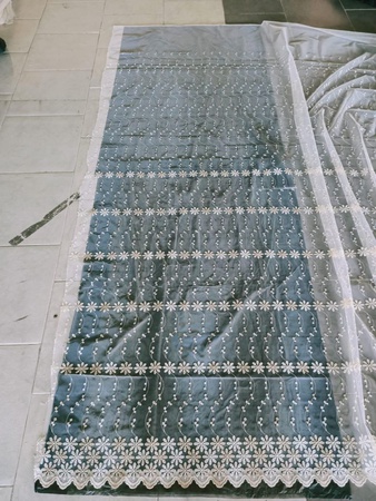 Тюлевая ткань с вышивкой