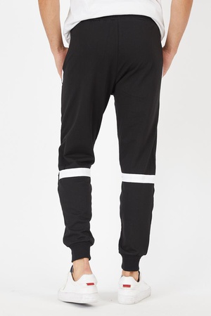 Fermuar cepli parça ve şerit detaylı eşofman altı