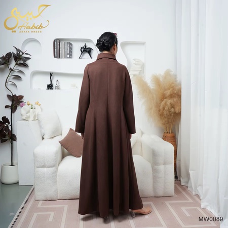 Long brown crossover coat with buttons.