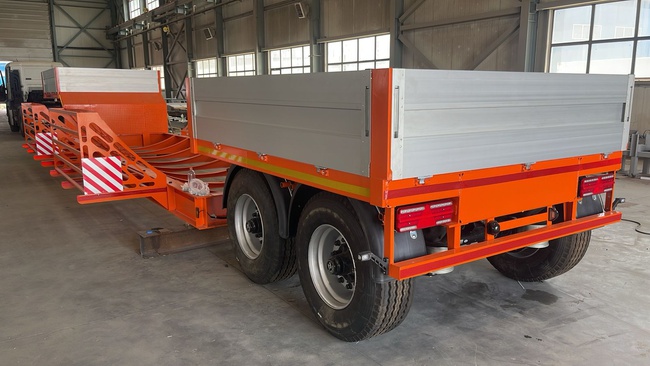 Трал низкорамный для перевозки пластиковых труб и Бочек из пластика диаметром до 5 метров