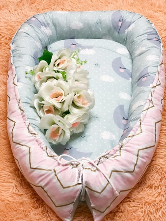 Кокон для новорождённого babynest