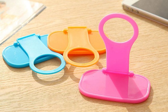 Phone holder for wall socket