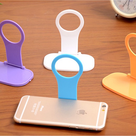 Phone holder for wall socket