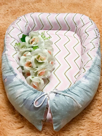 Кокон для новорождённого babynest